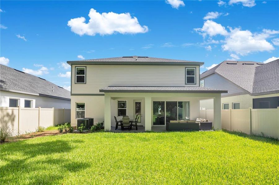 Exterior details and patio area of a home in Oakfield at Mount Dora Village Series, Mount Dora (Image 3).