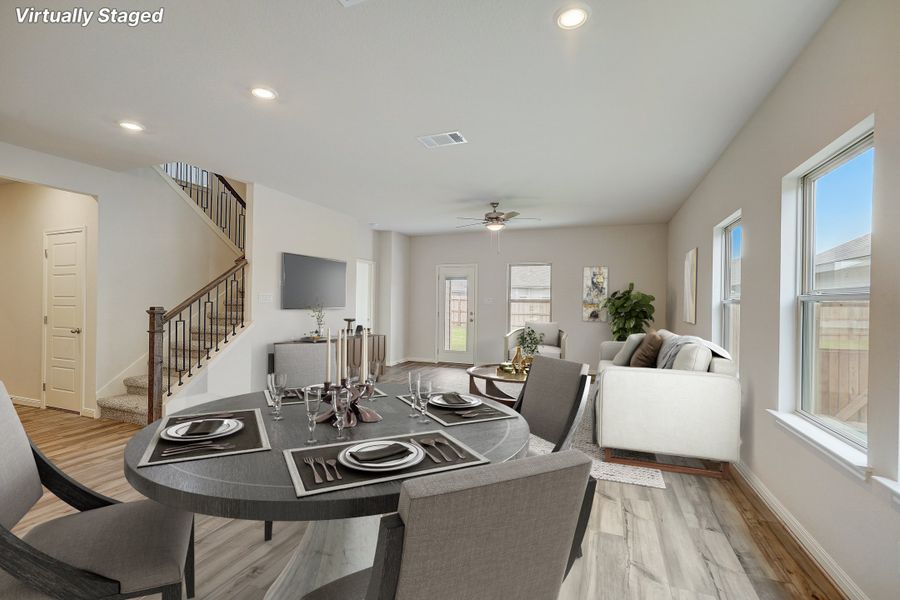 Virtually staged dining room and living room in the Pearl floorplan at a Meritage Homes community.