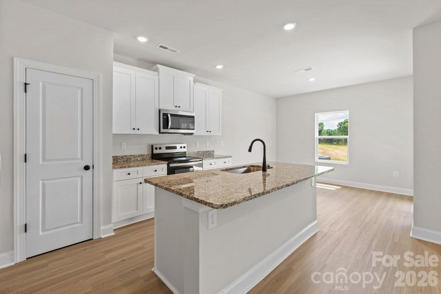Furnished interior view inside a new home in Stagecoach Station, Gastonia (Image 5).