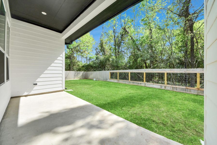 Another view of outside patio showcasing the privacy of no back neighbors.
