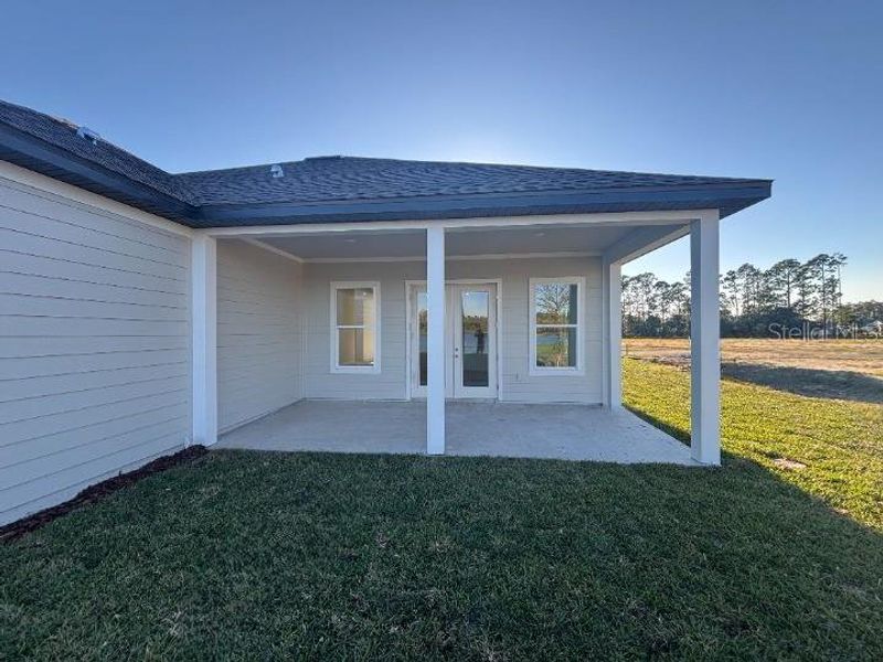 Exterior details and patio area of a home in Ardisia Park Estate, New Smyrna Beach (Image 4).