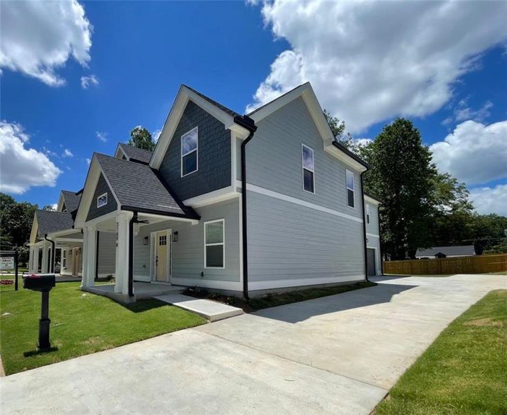 Front exterior of a new home in , Hapeville, GA, highlighting curb appeal (Image 15).
