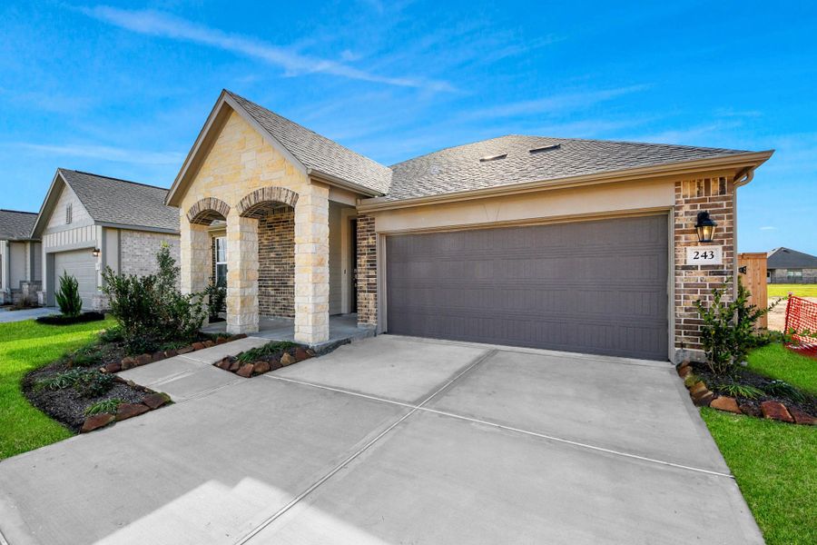 Front exterior of a new home in Laurel Landing: Landmark Collection, Alvin, TX, highlighting curb appeal (Image 2). Front exterior of a new home in Laurel Landing: Landmark Collection, Alvin, TX, highlighting curb appeal (Image 2).