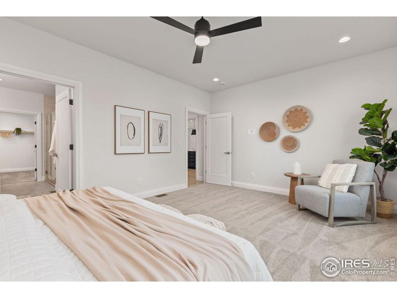 This is the spacious primary suite located at the back of the house