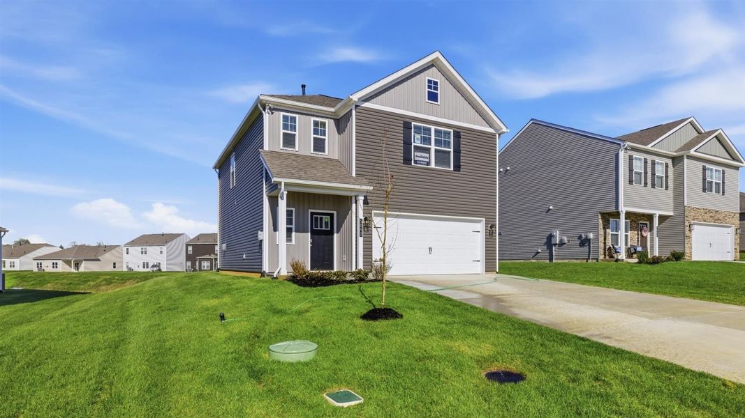 Front exterior of a new home in Millstone Village, Morristown, TN, highlighting curb appeal (Image 25).