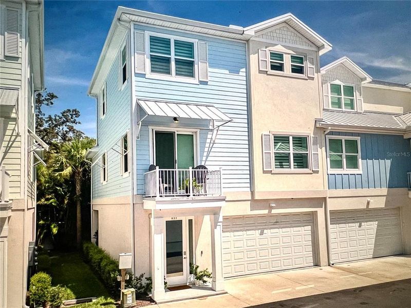 Front exterior of a new home in , Dunedin, FL, highlighting curb appeal (Image 19).