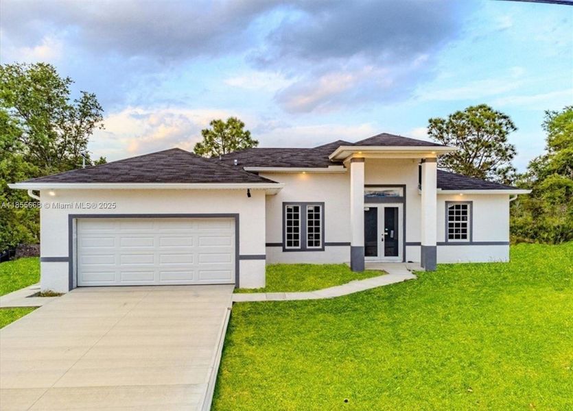 Front exterior of a new home in , Lehigh Acres, FL, highlighting curb appeal (Image 32).
