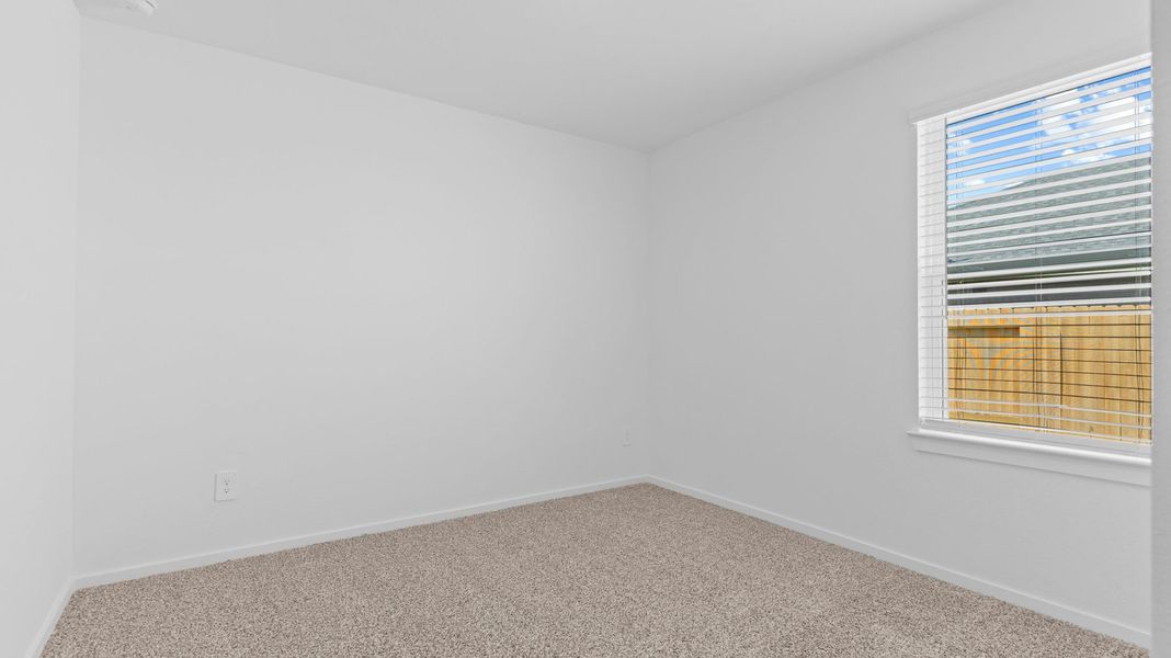 Spacious, unfurnished interior of a new home in Caldwell Crossing, Iowa Colony (Image 21).