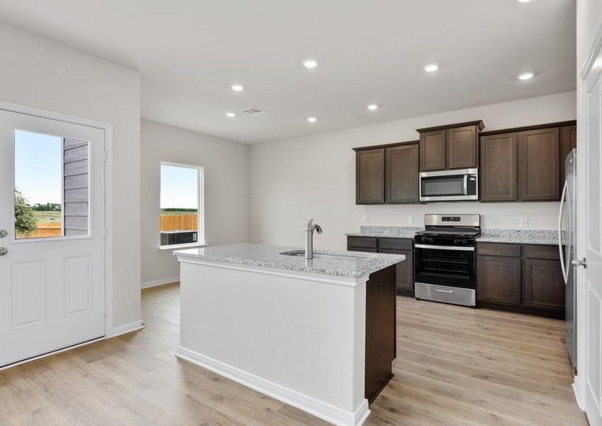 The kitchen has designer wood cabinetry. The kitchen has designer wood cabinetry.