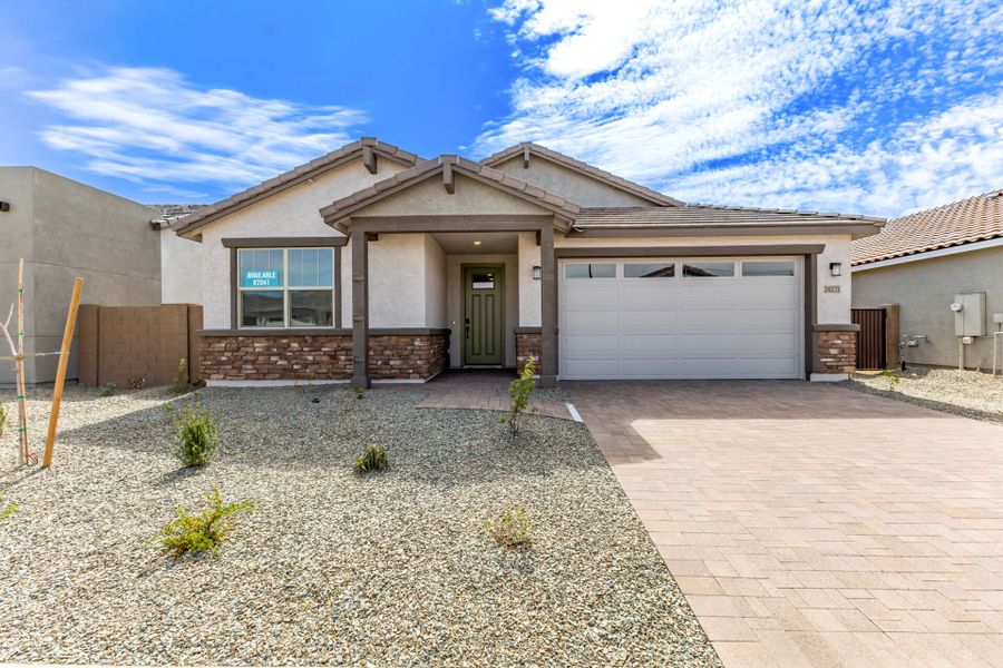 Front exterior of a new home in Tyler Ranch, Buckeye, AZ, highlighting curb appeal (Image 1). Front exterior of a new home in Tyler Ranch, Buckeye, AZ, highlighting curb appeal (Image 1).