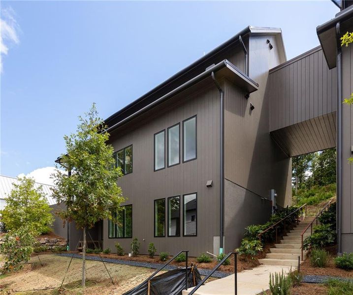 Front exterior of a new home in , Chattahoochee Hills, GA, highlighting curb appeal (Image 21).