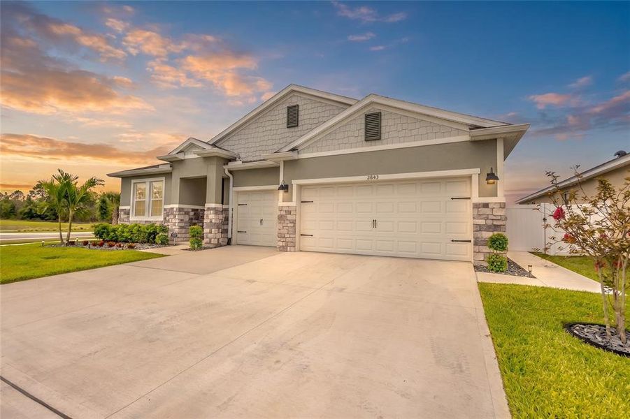 Front exterior of a new home in Harmony West, Harmony, FL, highlighting curb appeal (Image 25). Front exterior of a new home in Harmony West, Harmony, FL, highlighting curb appeal (Image 25).