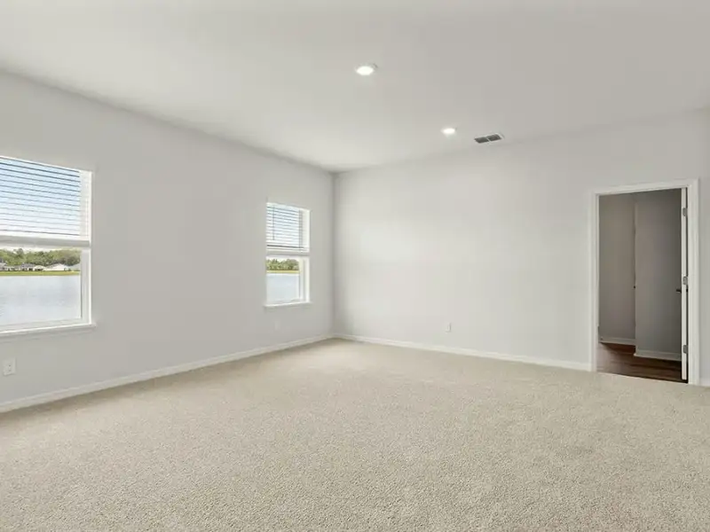 The spacious owner`s suite looks out at the lake. The spacious owner`s suite looks out at the lake.