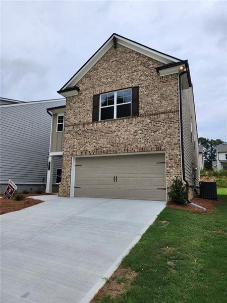 Front exterior of a new home in , Loganville, GA, highlighting curb appeal (Image 2). Front exterior of a new home in , Loganville, GA, highlighting curb appeal (Image 2).
