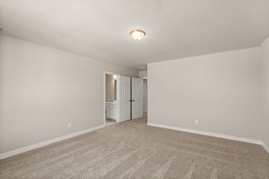 An additional view of the fourth bedroom with private bath.