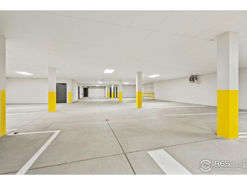 Unit 305 comes with one parking spot in this shared garage, equipped to handle the installation of car charging stations, wired directly to the unit.