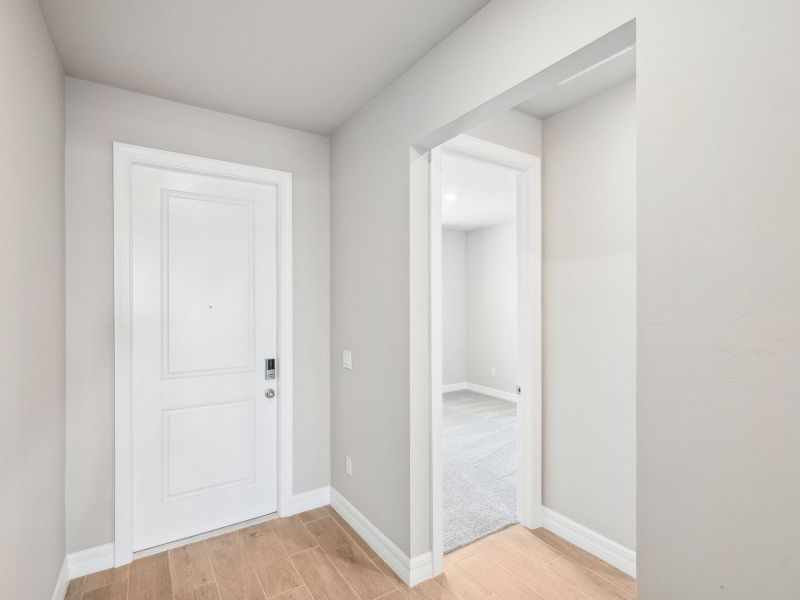 Spacious, unfurnished interior of a new home in Crescent Lakes - Reserve Series, Punta Gorda (Image 13).