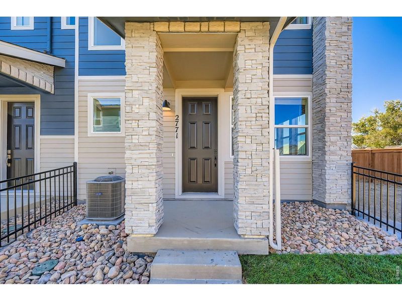 Exterior details and patio area of a home in Mountain Brook, Longmont (Image 3).