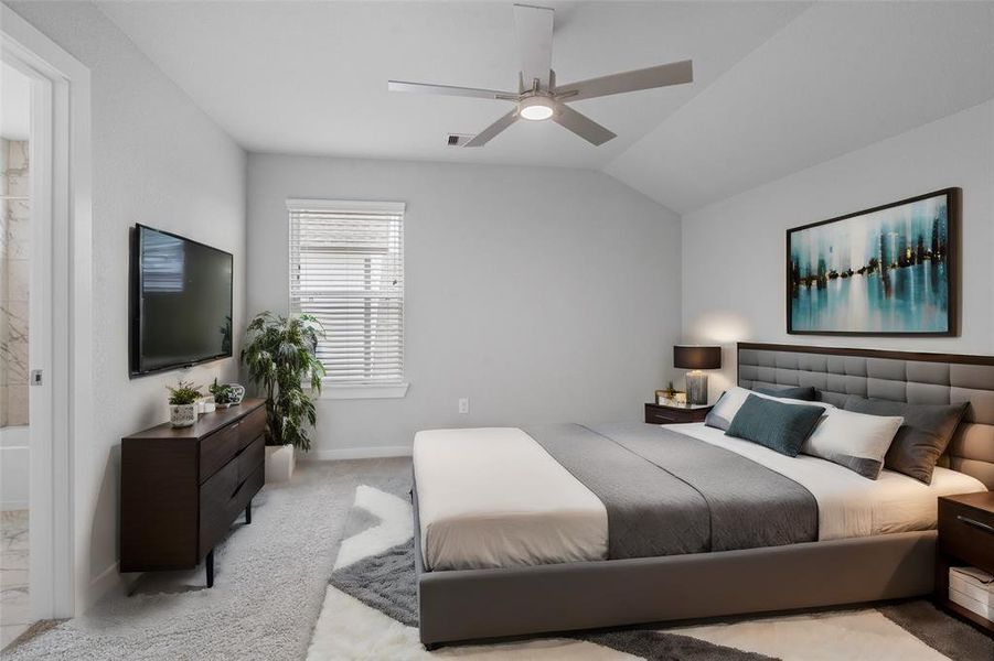 Secondary bedroom features plush carpet, custom paint, ceiling fan with lighting and a large window with privacy blinds. This secondary bedroom has its own private access to a secondary bathroom.