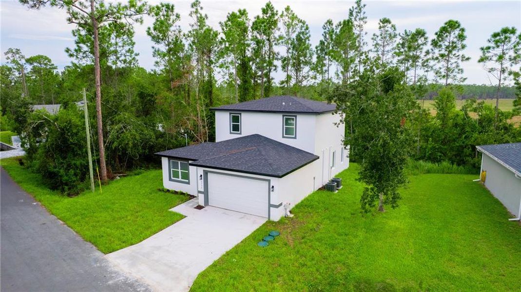 Front exterior of a new home in , St. Cloud, FL, highlighting curb appeal (Image 14). Front exterior of a new home in , St. Cloud, FL, highlighting curb appeal (Image 14).