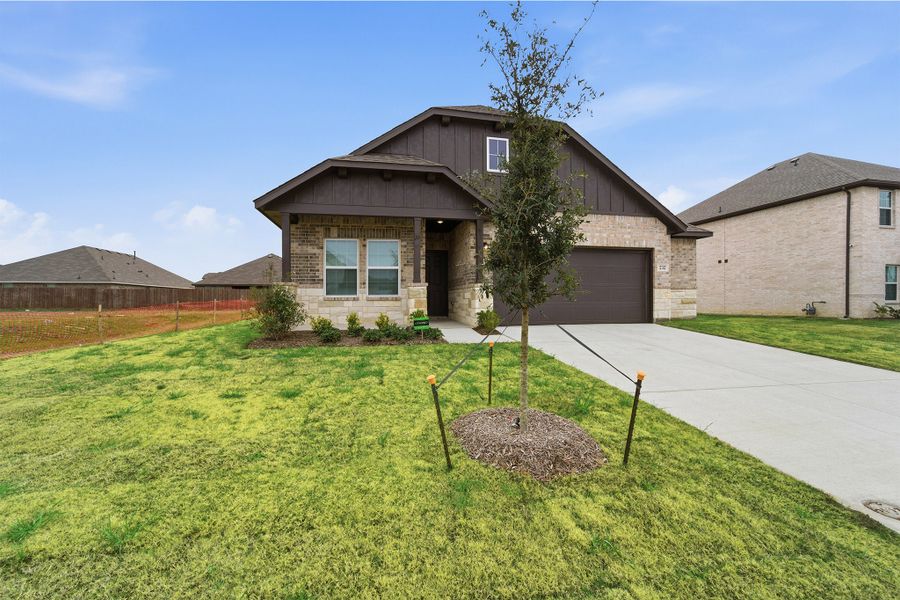 Front exterior of a new home in Saddlebrook Estates, Waxahachie, TX, highlighting curb appeal (Image 25).