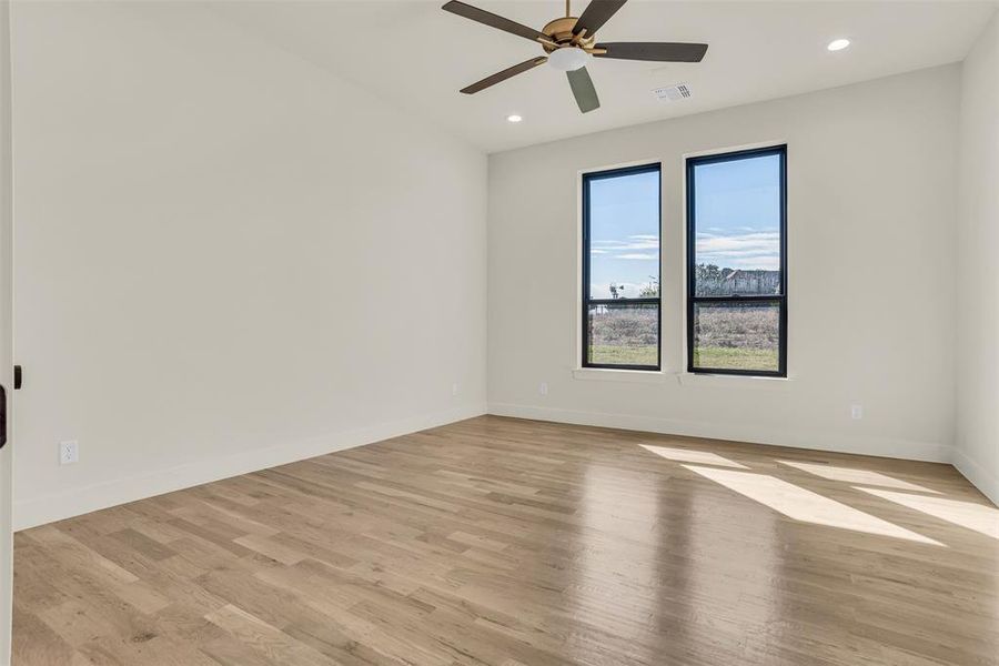 Spare room with light wood-style flooring, recessed lighting, and ceiling fan