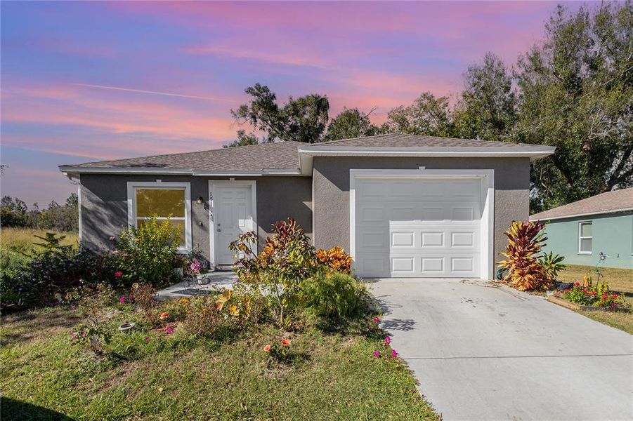 Front exterior of a new home in , Winter Haven, FL, highlighting curb appeal (Image 2). Front exterior of a new home in , Winter Haven, FL, highlighting curb appeal (Image 2).