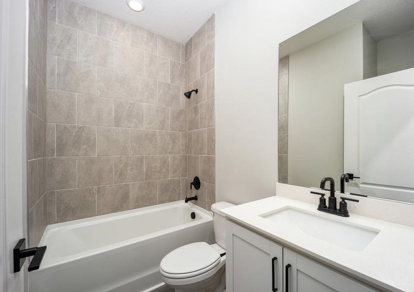 The secondary bathroom has modern fixtures and finishes