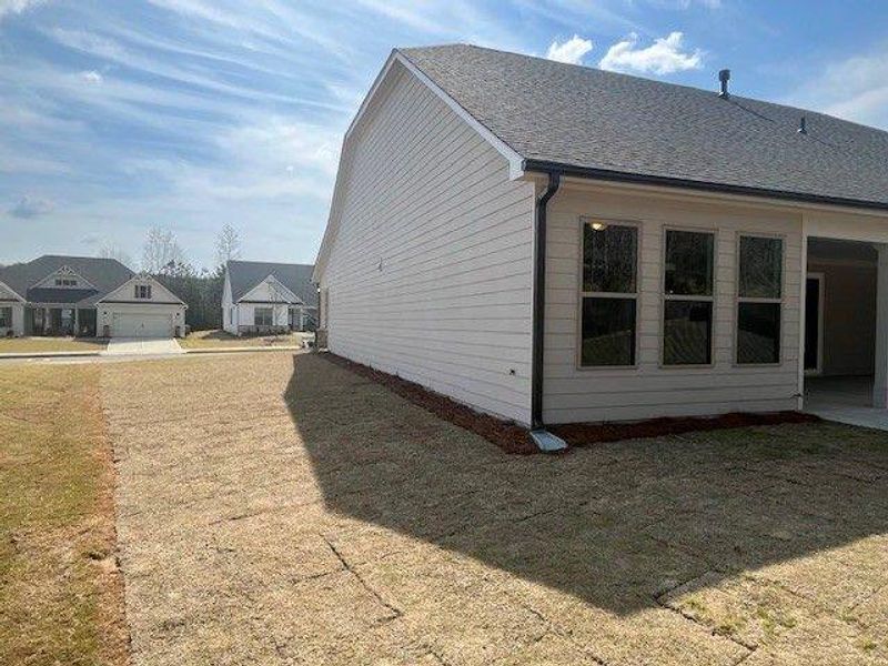 Exterior details and patio area of a home in Soleil Belmont Park, Canton (Image 11).