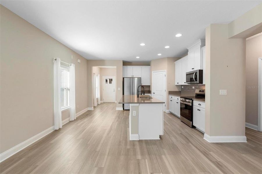 Stunning kitchen area with so much natural light!