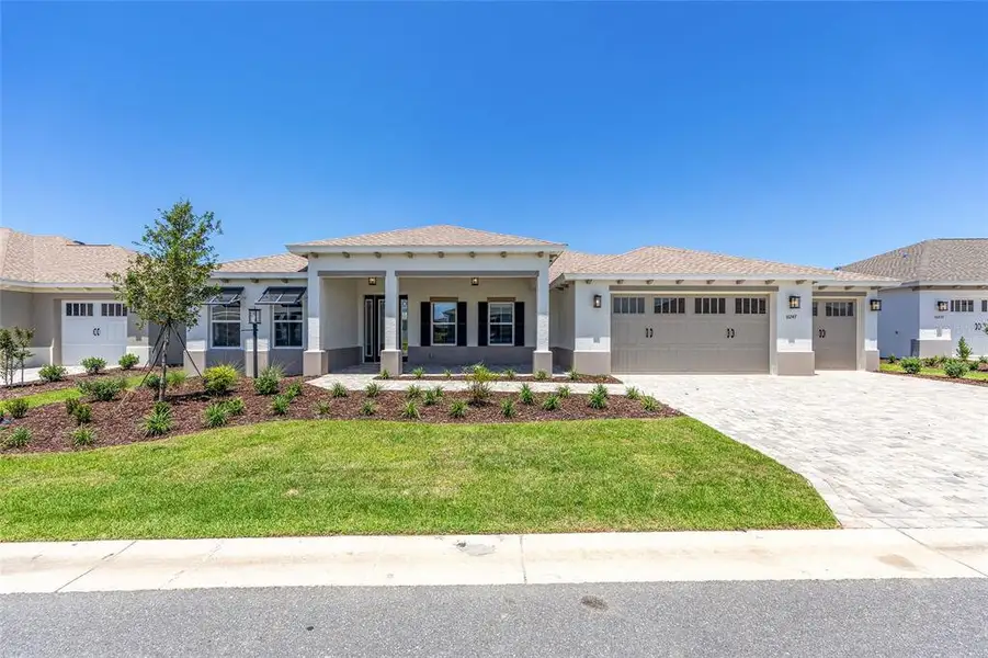 Front exterior of a new home in , Ocala, FL, highlighting curb appeal (Image 2). Front exterior of a new home in , Ocala, FL, highlighting curb appeal (Image 2).