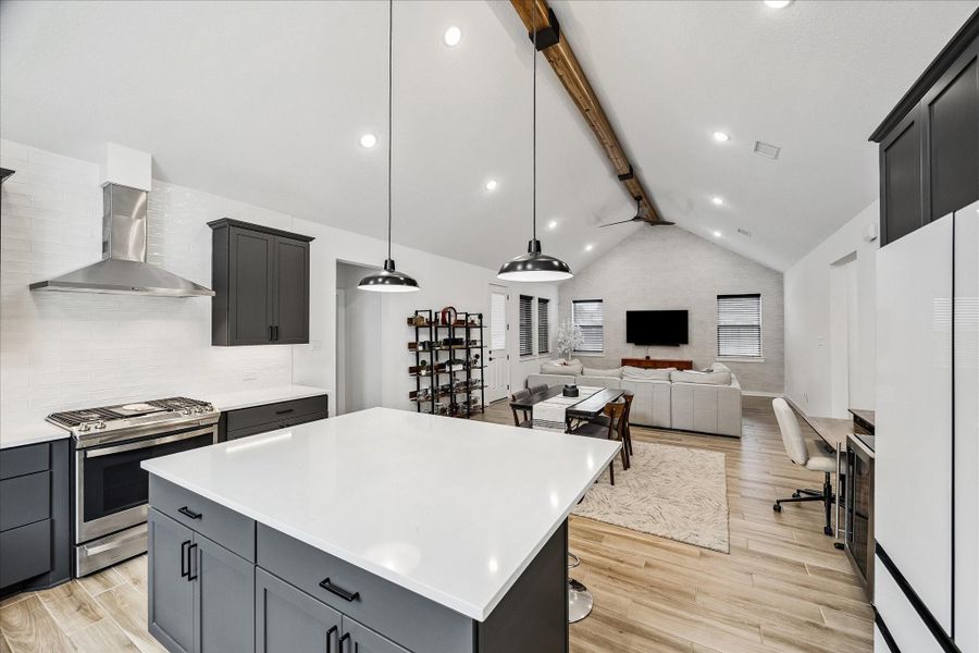 Open dining and living areas flow effortlessly from the kitchen, creating an ideal layout for gatherings, entertaining, or relaxed everyday living.