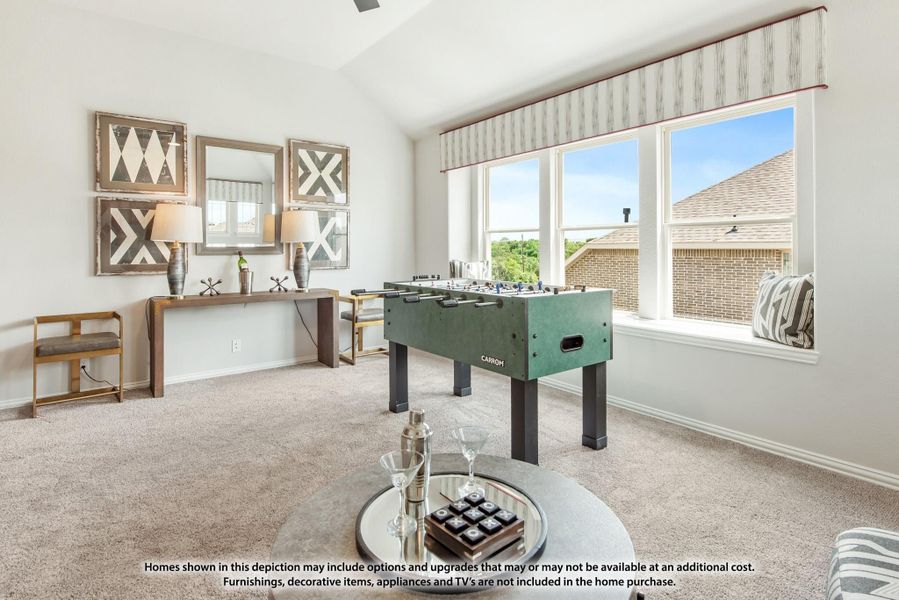 Game room with foosball table, carpet flooring, vaulted ceiling, and large windows