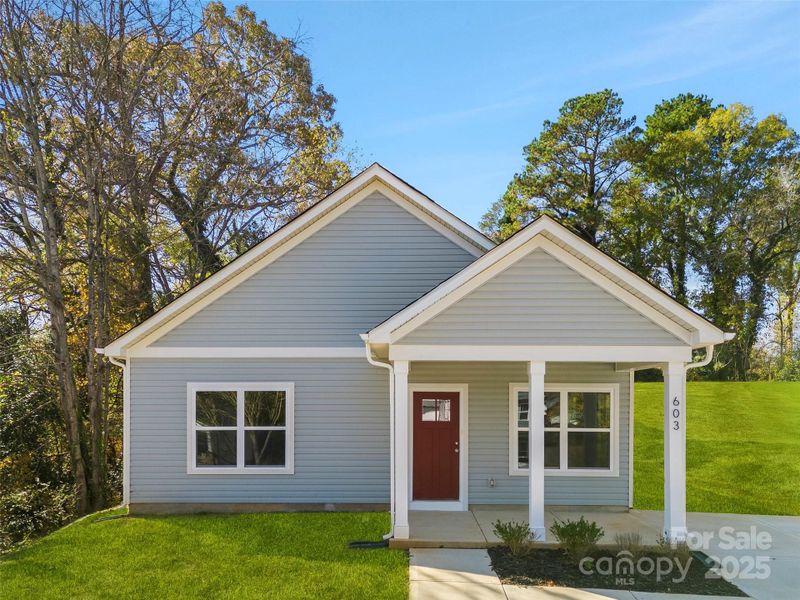 Front exterior of a new home in , Spencer, NC, highlighting curb appeal (Image 17).