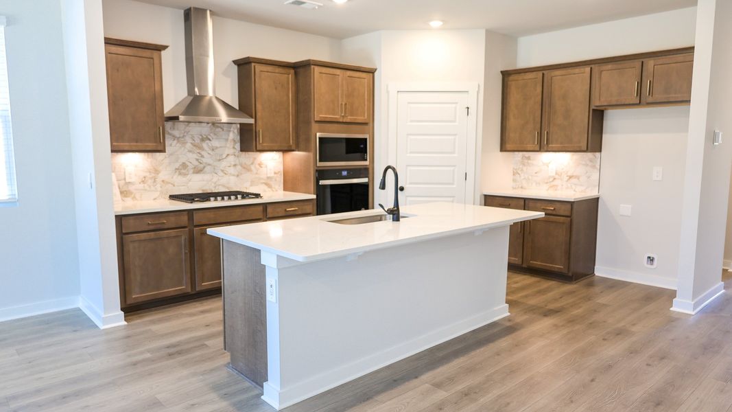 Representative furnished interior of a home built from the EMBRY by D.R. Horton in Harvest Point, Spring Hill (Image 8).