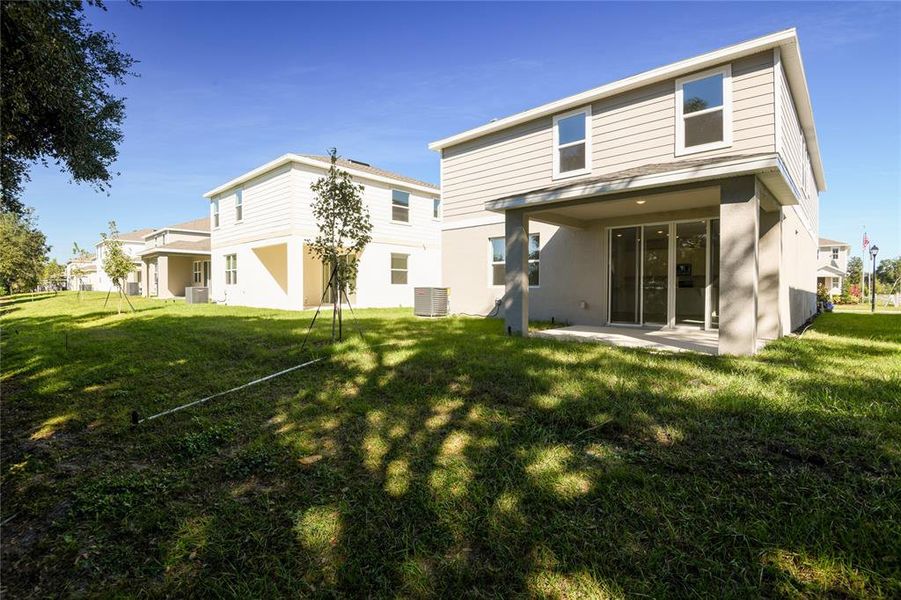 Exterior details and patio area of a home in Seasons at Shores of Lake Dell, Dundee (Image 4).