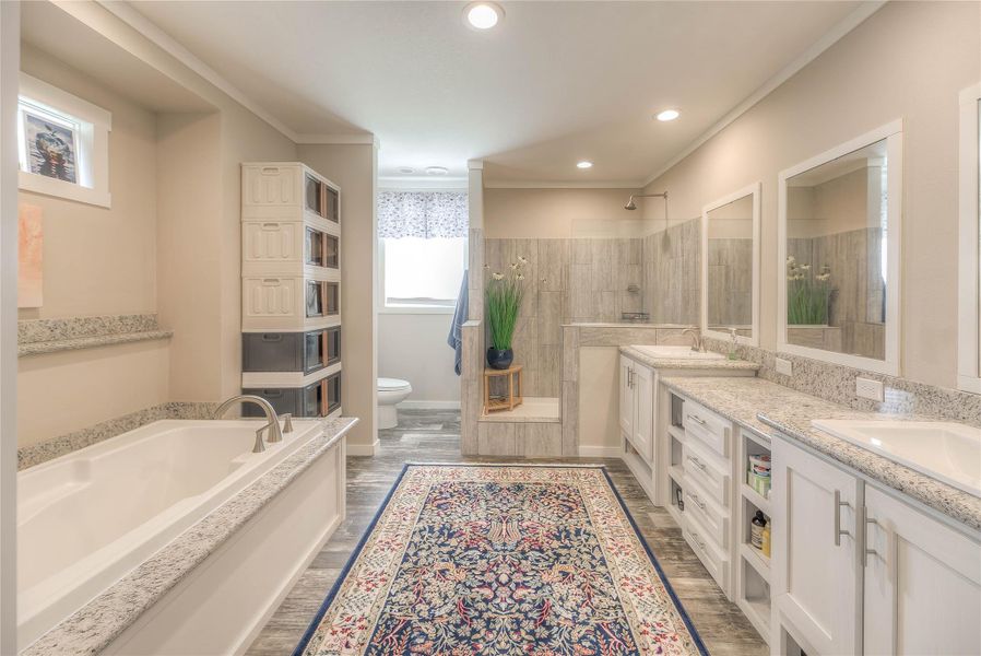 Huge primary bath with double sinks and large soaking tub.
