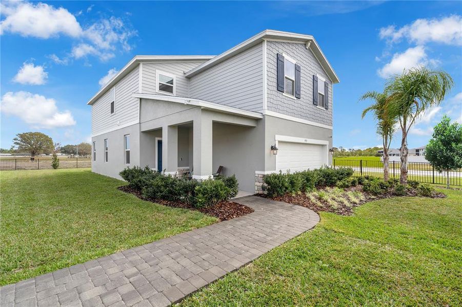 Front exterior of a new home in Avalon Park Tavares Single Family Homes, Tavares, FL, highlighting curb appeal (Image 25).
