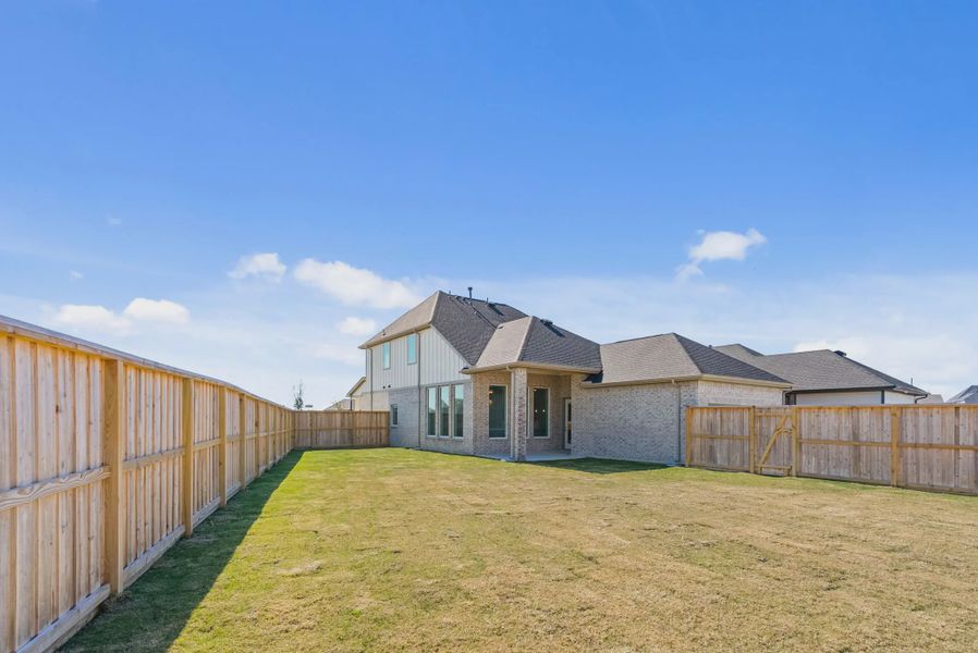 Representative exterior details of a home built from the St Andrews by Chesmar Homes in Riceland Alley Loads, Mont Belvieu (Image 4).