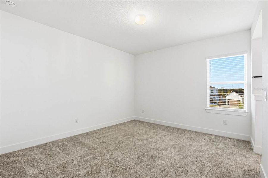 Spacious, unfurnished interior of a new home in Vida's Way, Wesley Chapel (Image 55).