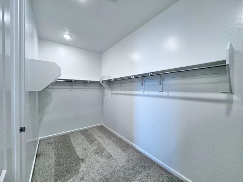 Primary walk in closet Primary walk in closet