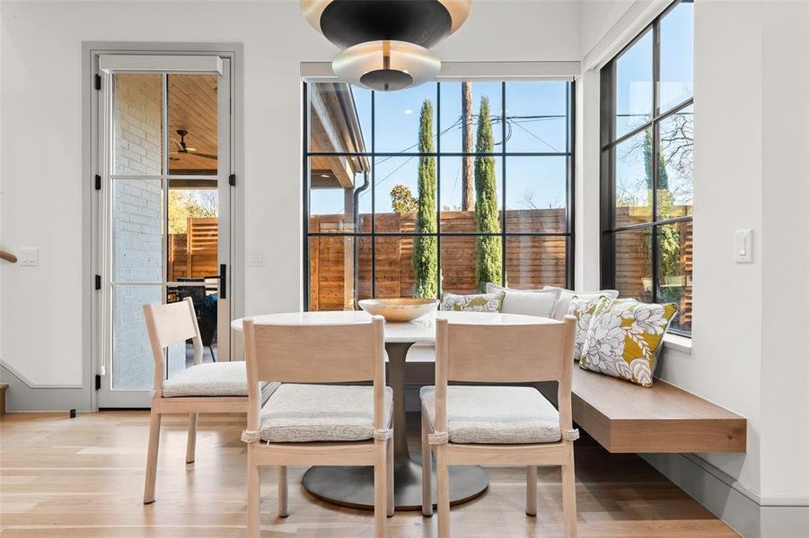 Dining space with light wood-style floors