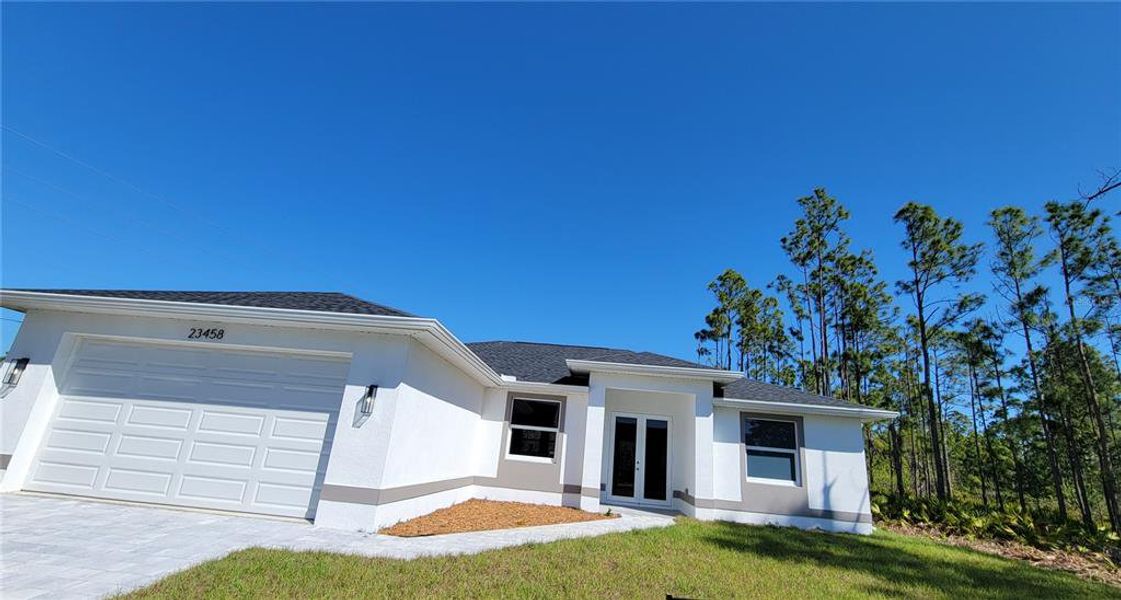 Front exterior of a new home in , Punta Gorda, FL, highlighting curb appeal (Image 16). Front exterior of a new home in , Punta Gorda, FL, highlighting curb appeal (Image 16).