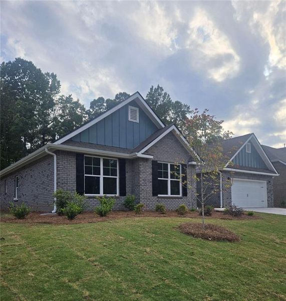 Front exterior of a new home in Mirror Lake at South Harbour, Villa Rica, GA, highlighting curb appeal (Image 1).
