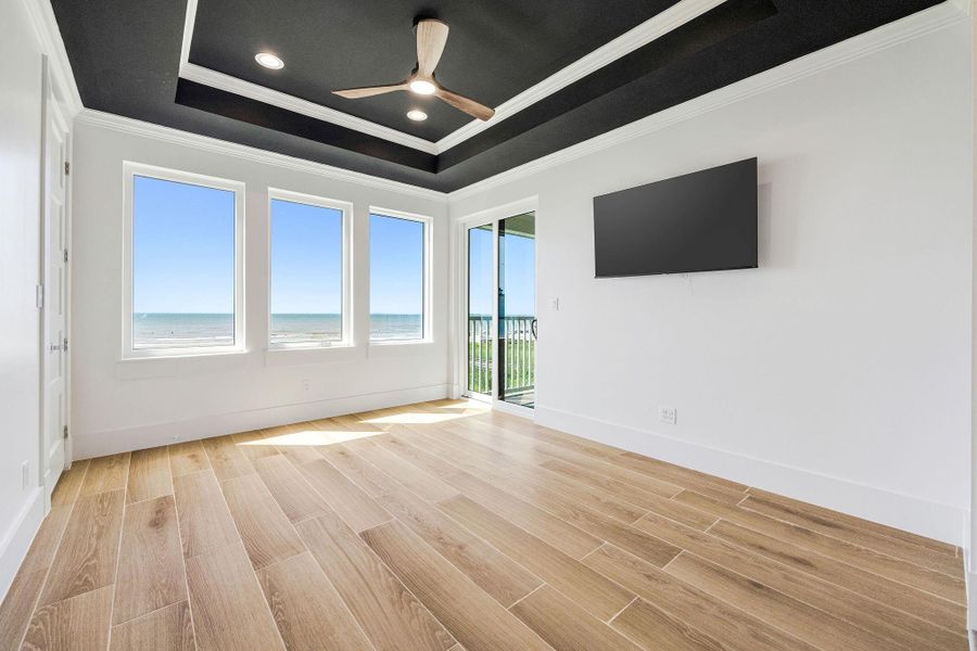 Secondary bedroom on the second floor with views and balcony access.