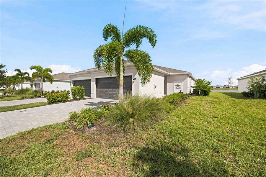Front exterior of a new home in , Englewood, FL, highlighting curb appeal (Image 28). Front exterior of a new home in , Englewood, FL, highlighting curb appeal (Image 28).