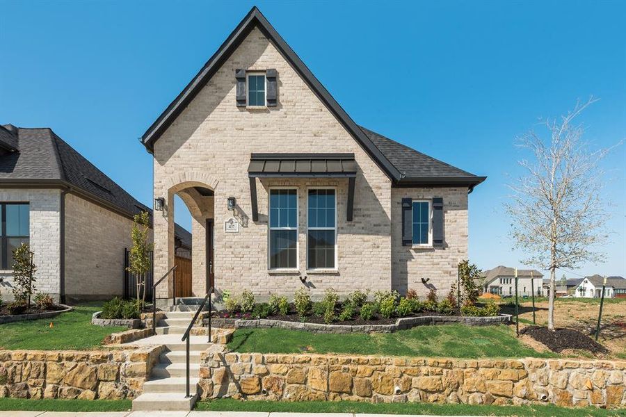 Front exterior of a new home in Cottages of Celina, Celina, TX, highlighting curb appeal (Image 22).