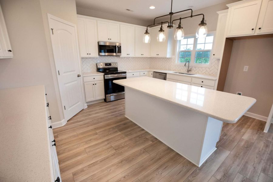 Representative furnished interior of a home built from the Drayton by Caviness & Cates Communities in Bartlett Manor, Youngsville (Image 158).