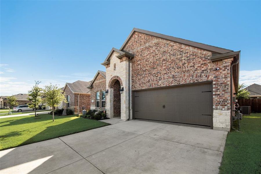 Front exterior of a new home in , Aubrey, TX, highlighting curb appeal (Image 23).