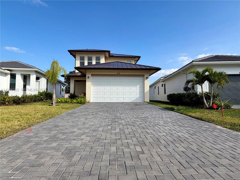 Front exterior of a new home in , Port St. Lucie, FL, highlighting curb appeal (Image 28).